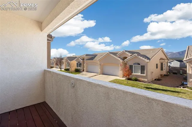 a view of a room with a ceiling fan