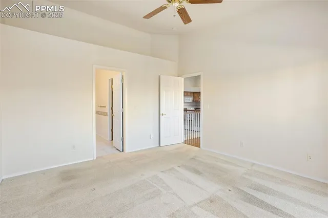 a bathroom with a toilet a sink and a large mirror