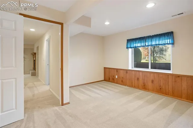 a view of hallway with a wooden door