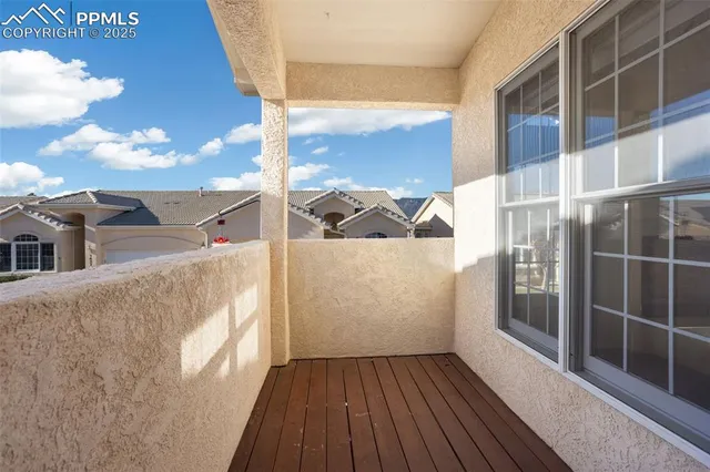 a view of a kitchen with an entryway and a window
