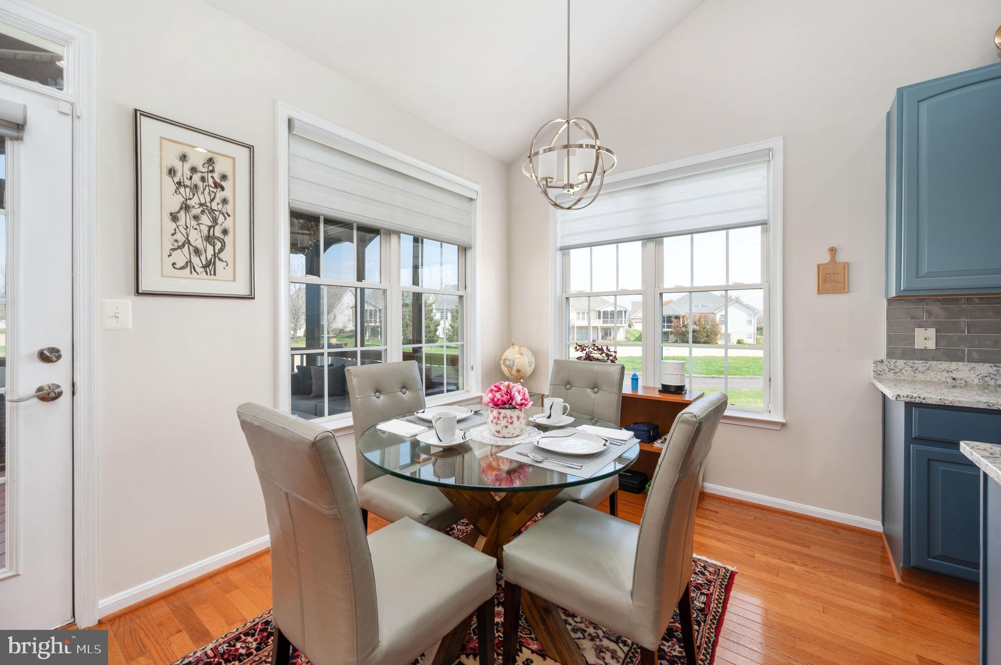 13700 Fieldstone Way Gainesville, VA 20155 - Photo 13 of 53 a view of a dining room with furniture window and wooden floor