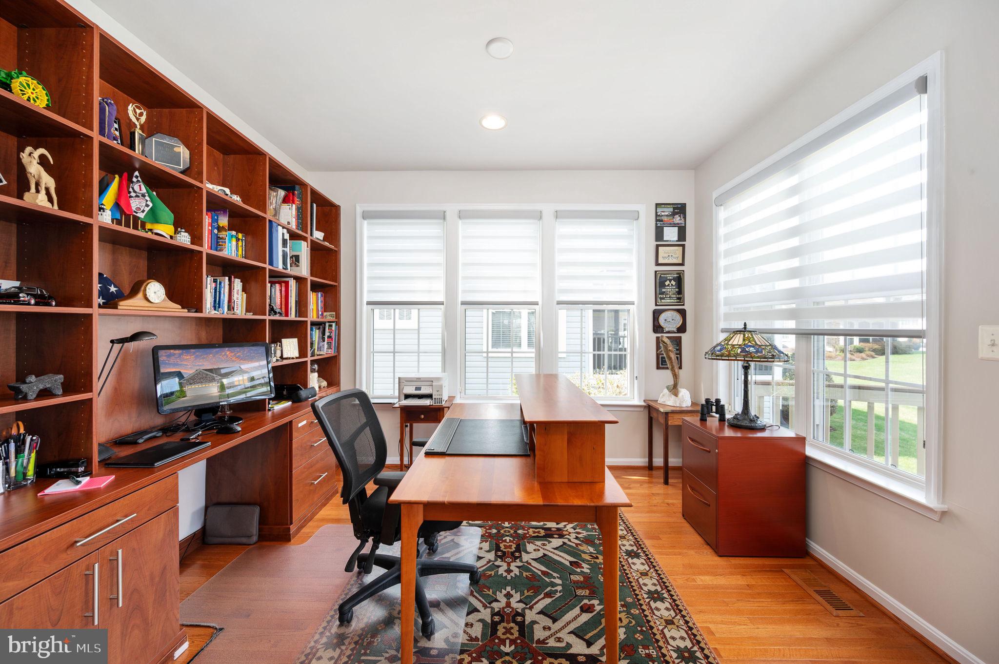 13700 Fieldstone Way Gainesville, VA 20155 - Photo 18 of 53 a living room with furniture and a book shelf