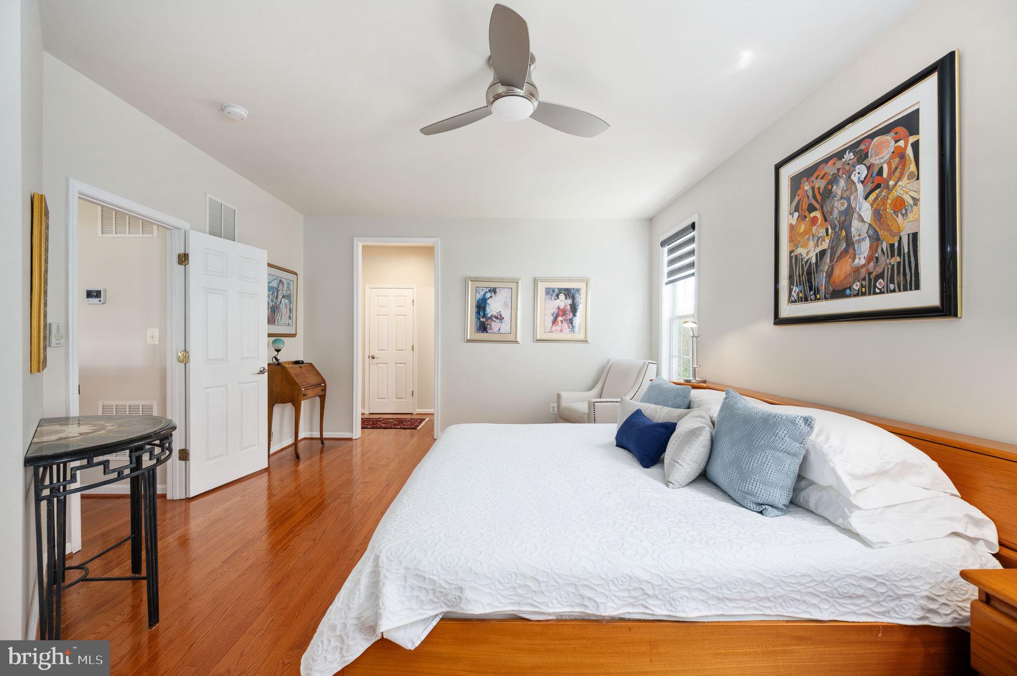 13700 Fieldstone Way Gainesville, VA 20155 - Photo 21 of 53 a bedroom with a bed and wooden floor
