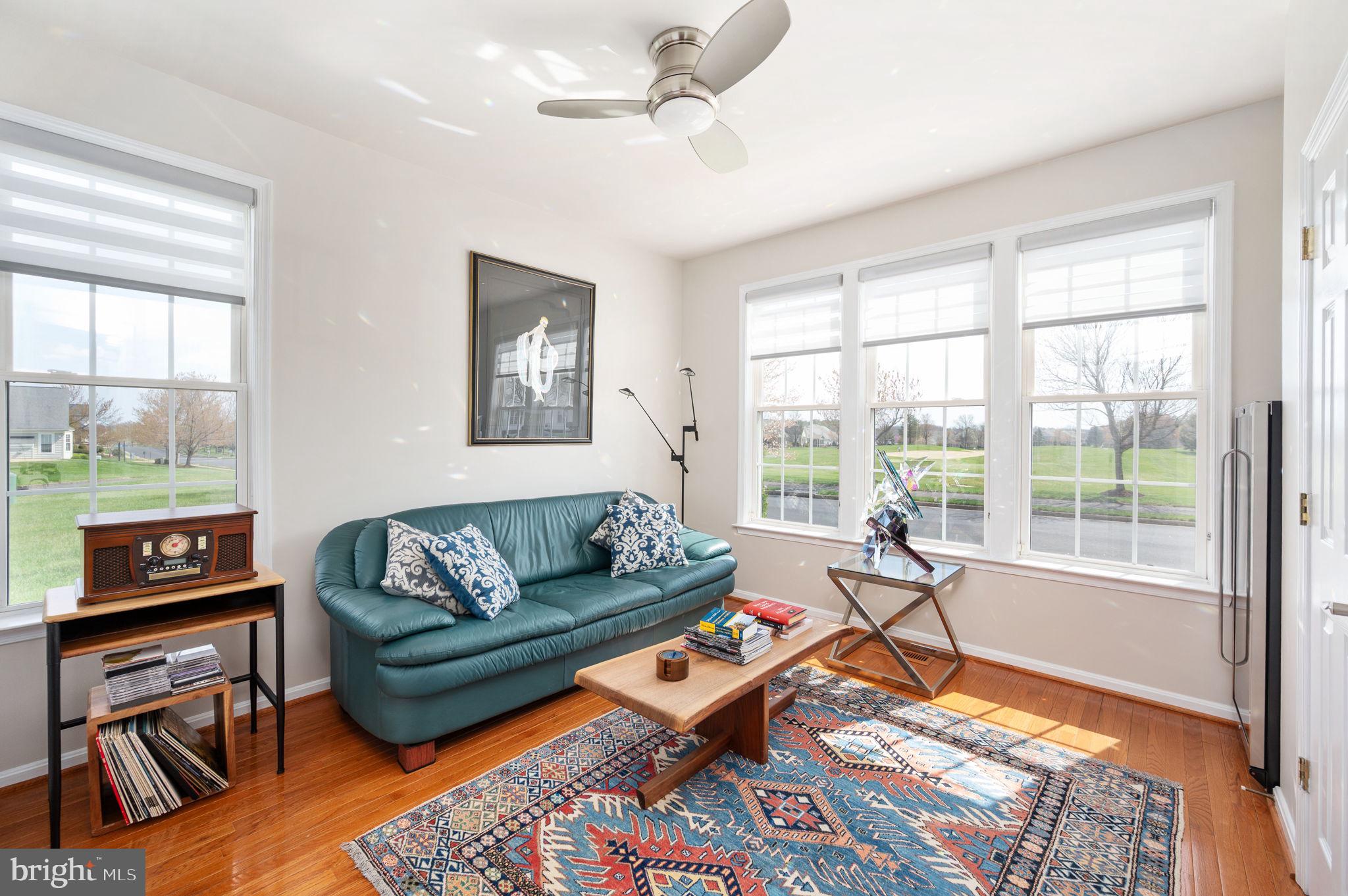13700 Fieldstone Way Gainesville, VA 20155 - Photo 25 of 53 a living room with furniture and a floor to ceiling window