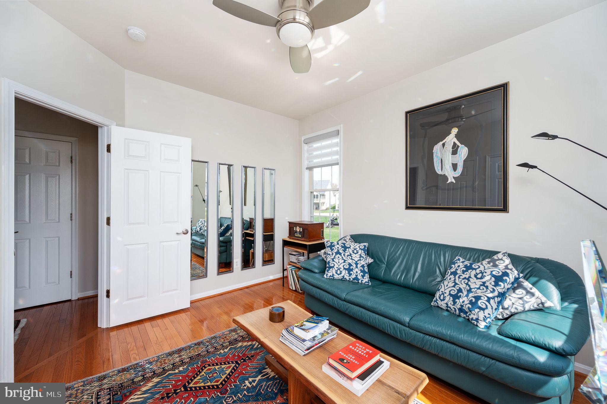 13700 Fieldstone Way Gainesville, VA 20155 - Photo 26 of 53 a living room with furniture and wooden floor