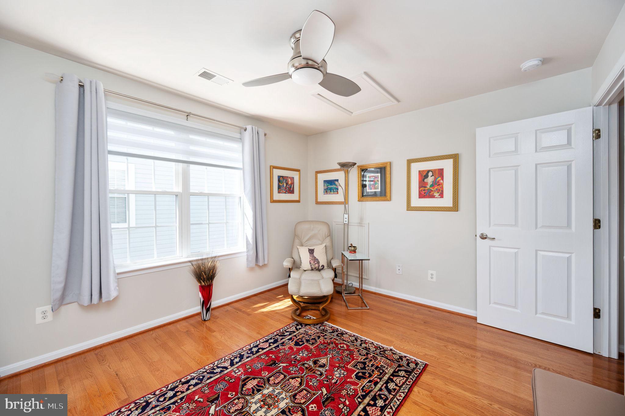 13700 Fieldstone Way Gainesville, VA 20155 - Photo 32 of 53 a living room with furniture rug and window