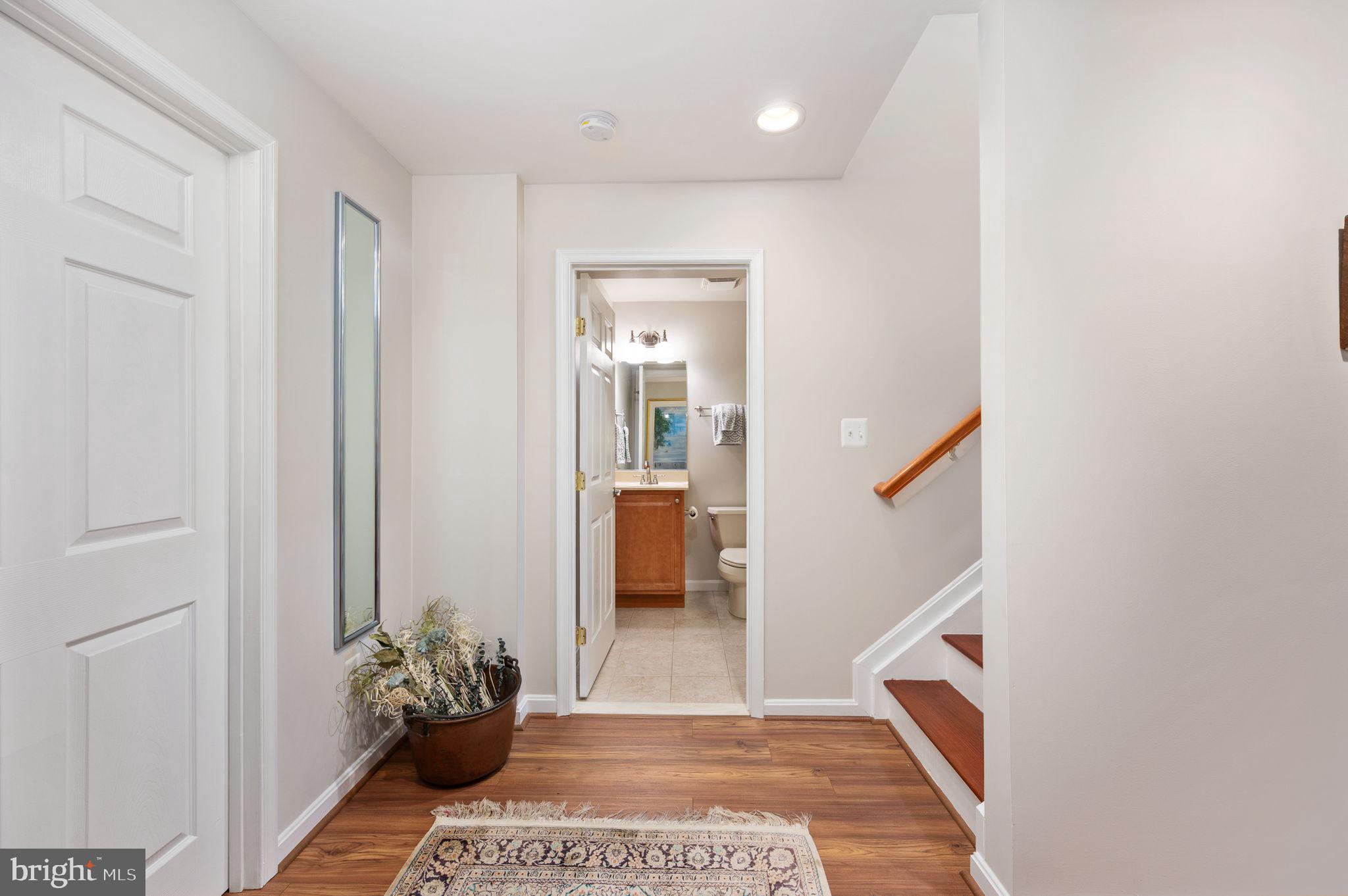 13700 Fieldstone Way Gainesville, VA 20155 - Photo 33 of 53 a view of a hallway to a livingroom with an empty space and a window