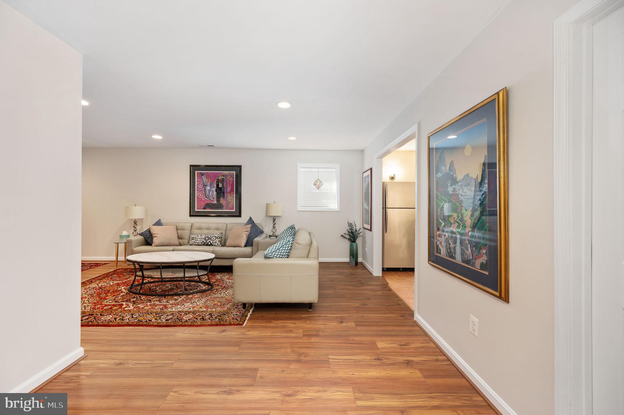 13700 Fieldstone Way Gainesville, VA 20155 - Photo 39 of 53 a living room with furniture or couch and a wooden floor