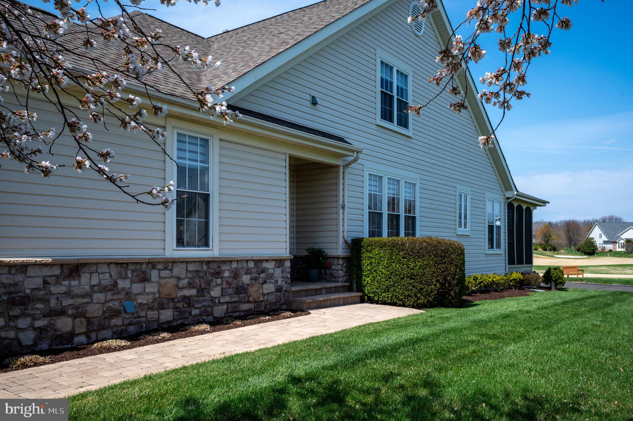 13700 Fieldstone Way Gainesville, VA 20155 - Photo 4 of 53 a backyard of a house with a garden and barbeque oven