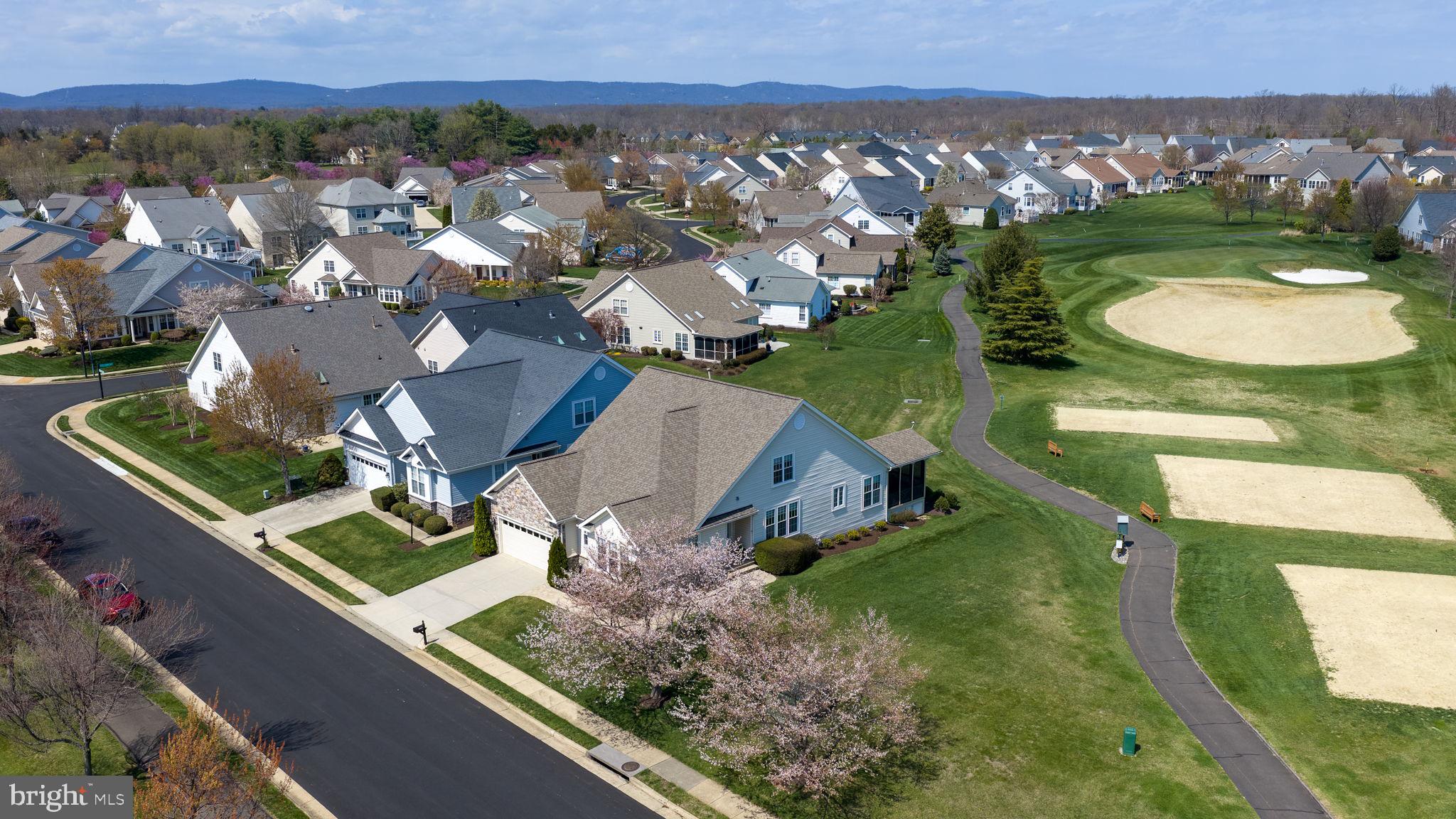 13700 Fieldstone Way Gainesville, VA 20155 - Photo 46 of 53 an aerial view of a house with a garden and mountain view in back