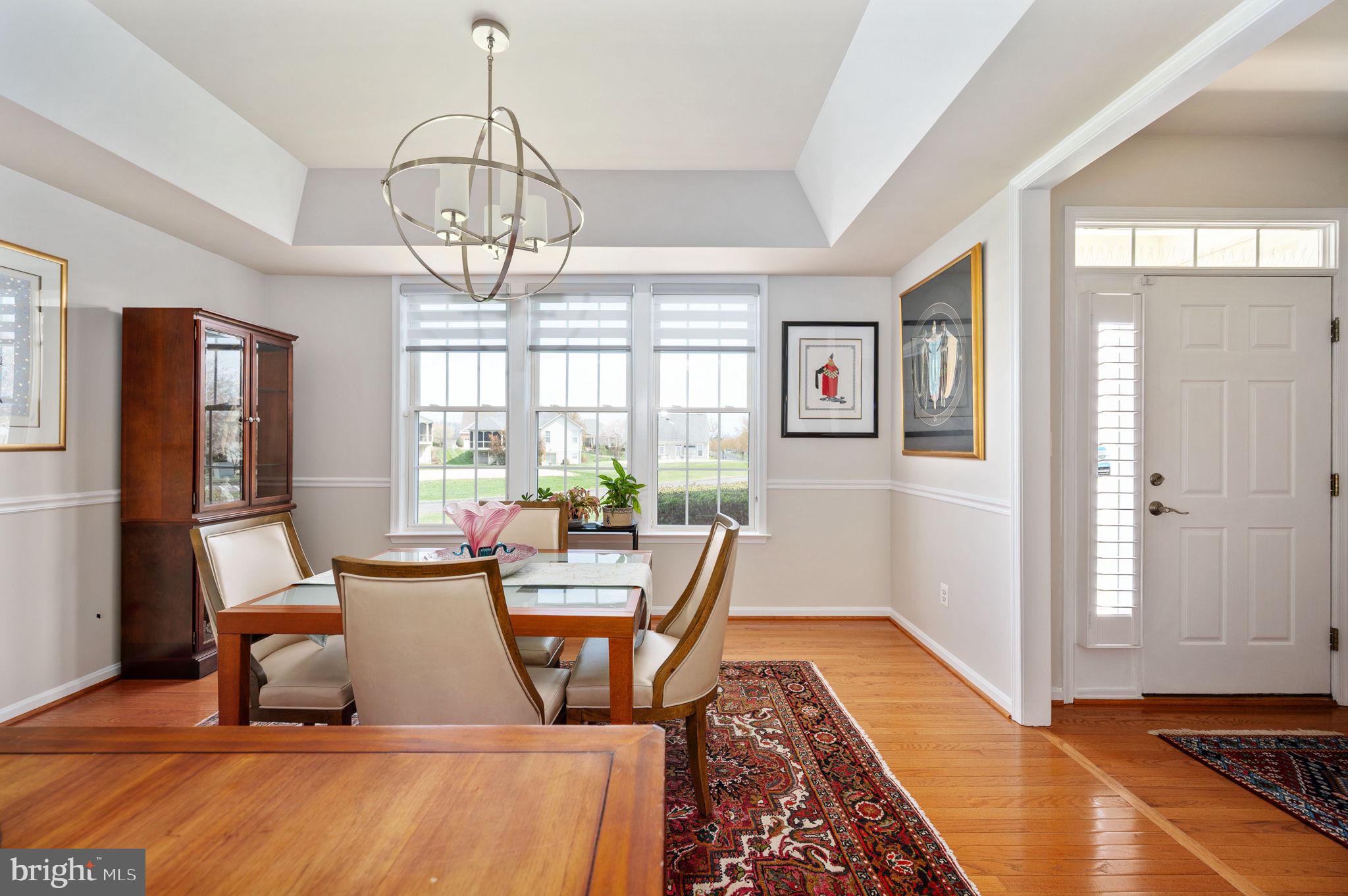 13700 Fieldstone Way Gainesville, VA 20155 - Photo 8 of 53 a living room with furniture two window and a dining table