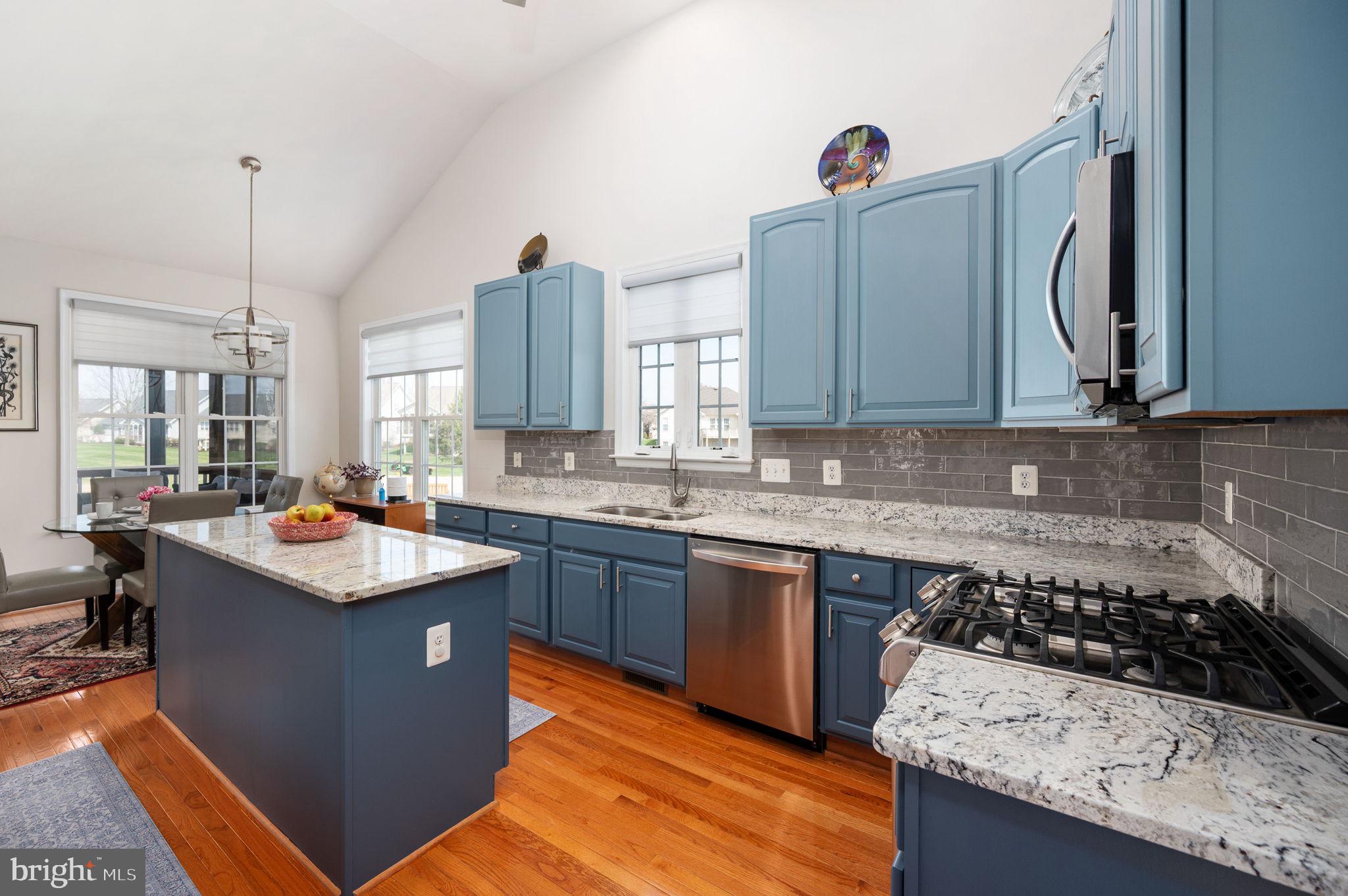13700 Fieldstone Way Gainesville, VA 20155 - Photo 9 of 53 a kitchen with a sink a stove and cabinets