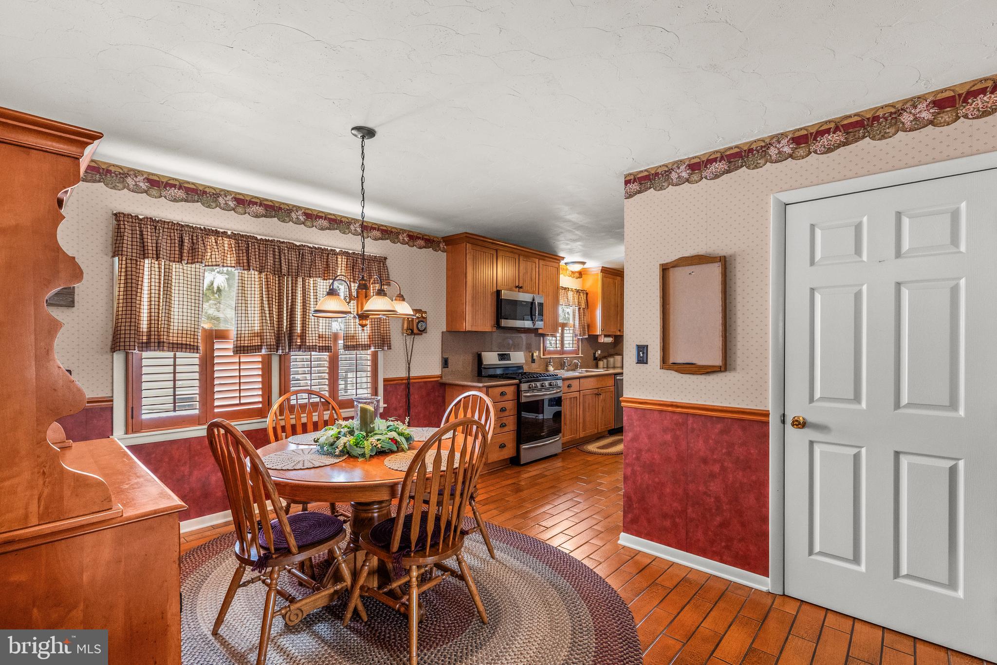 136 Conewago Drive Hanover, PA 17331 - Photo 11 of 41 a view of a dining room with furniture window and wooden floor