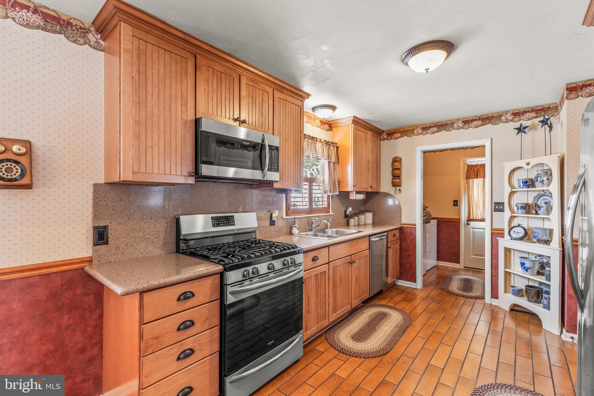 136 Conewago Drive Hanover, PA 17331 - Photo 13 of 41 a kitchen with stainless steel appliances granite countertop a stove and a sink