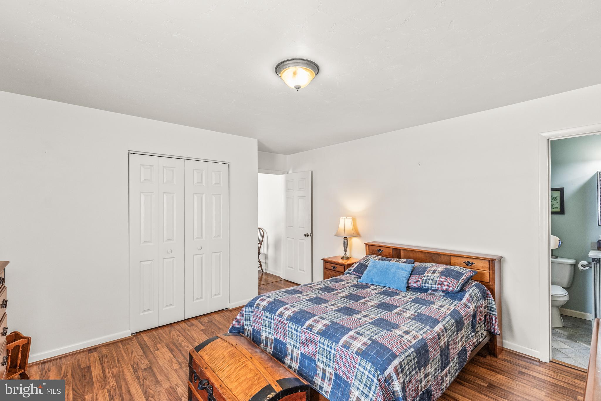 136 Conewago Drive Hanover, PA 17331 - Photo 19 of 41 a bedroom with a bed and a lamp on dresser