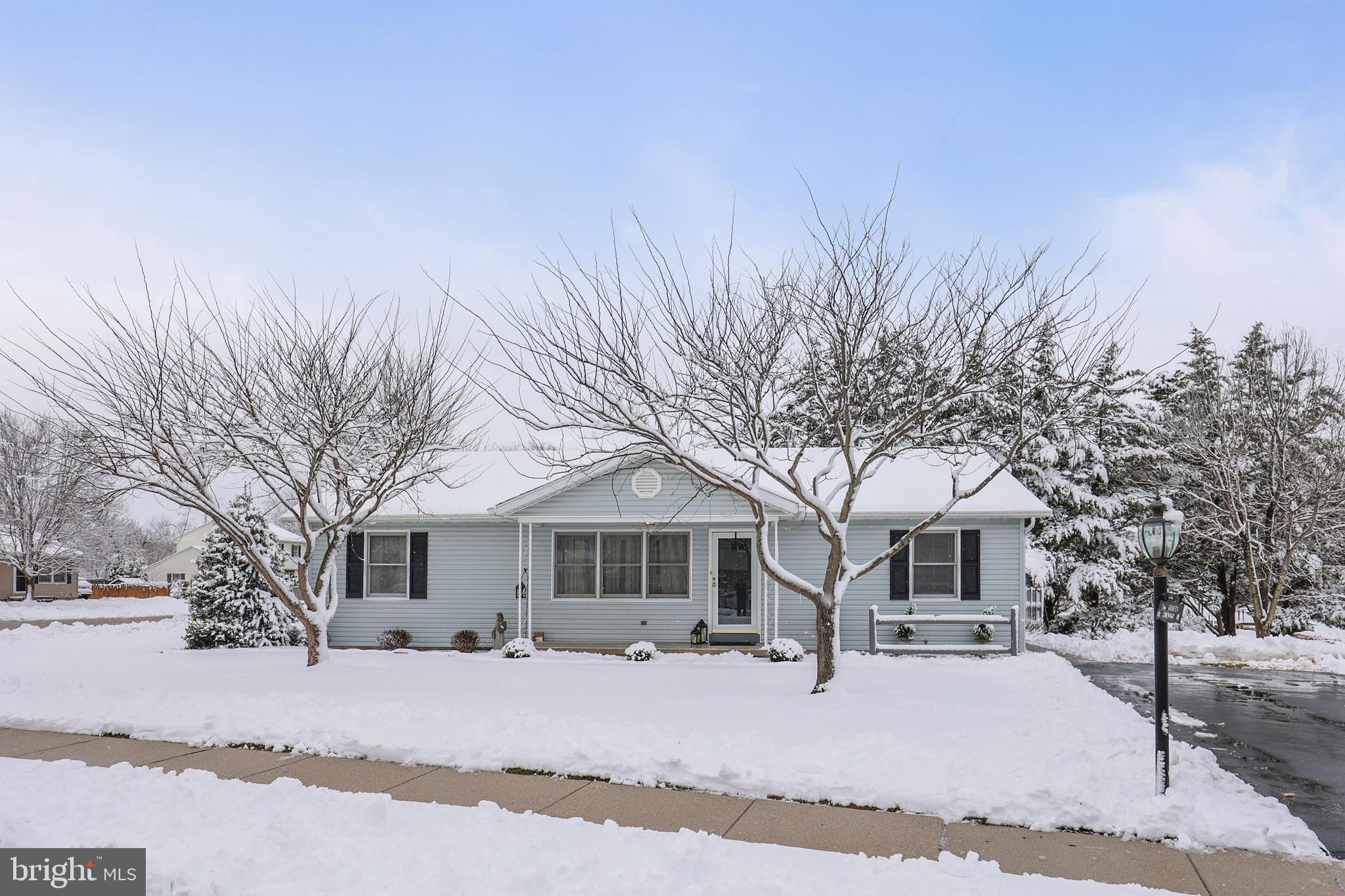 136 Conewago Drive Hanover, PA 17331 - Photo 3 of 41 a front view of a house with a yard covered in snow