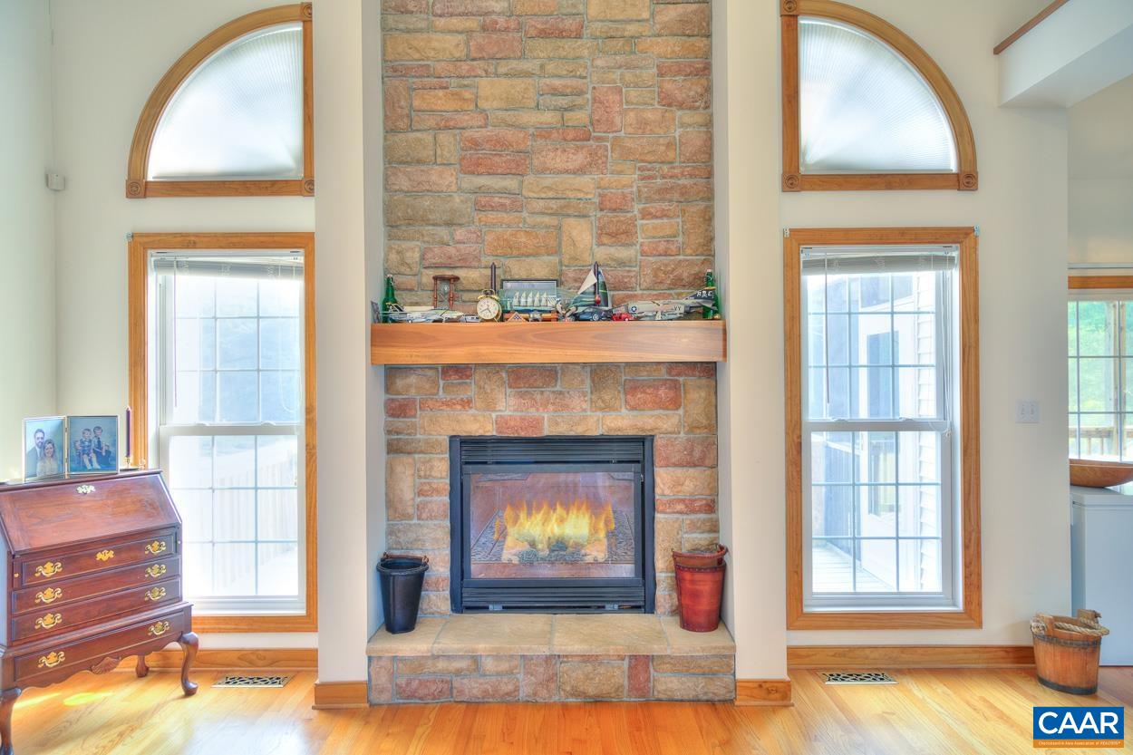 1908 Hollands Road Palmyra, VA 22963 - Photo 12 of 41 a living room with fireplace and a fireplace