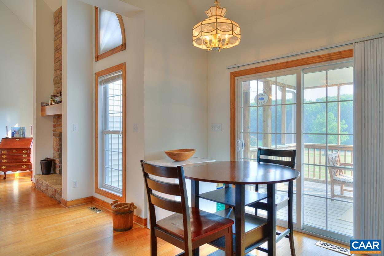 1908 Hollands Road Palmyra, VA 22963 - Photo 14 of 41 a view of a dining room with furniture window and wooden floor
