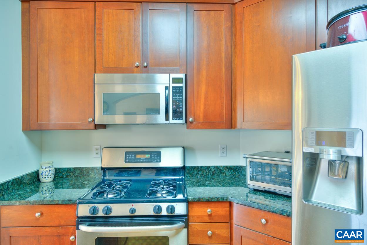 1908 Hollands Road Palmyra, VA 22963 - Photo 18 of 41 a kitchen with stainless steel appliances granite countertop a stove a sink and a microwave