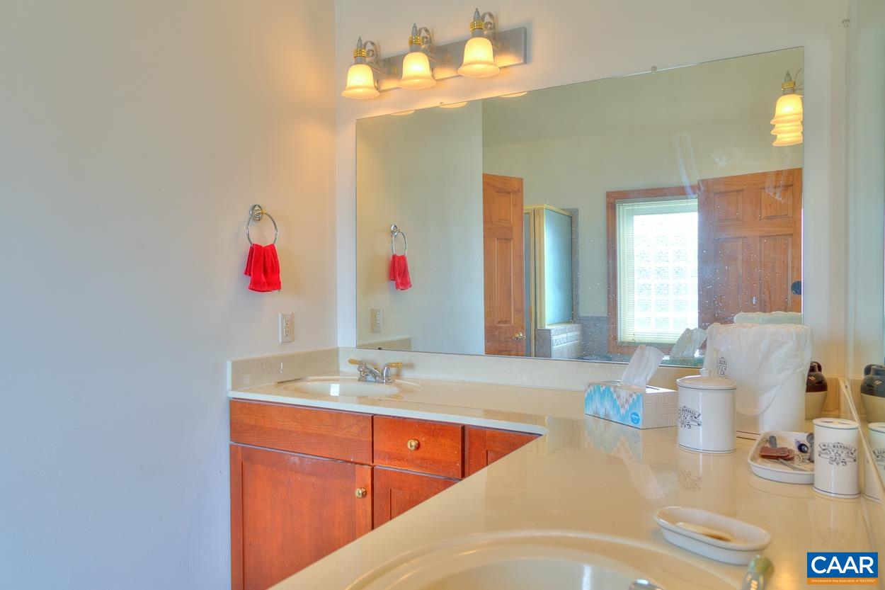 1908 Hollands Road Palmyra, VA 22963 - Photo 25 of 41 a bathroom with a sink vanity and a mirror