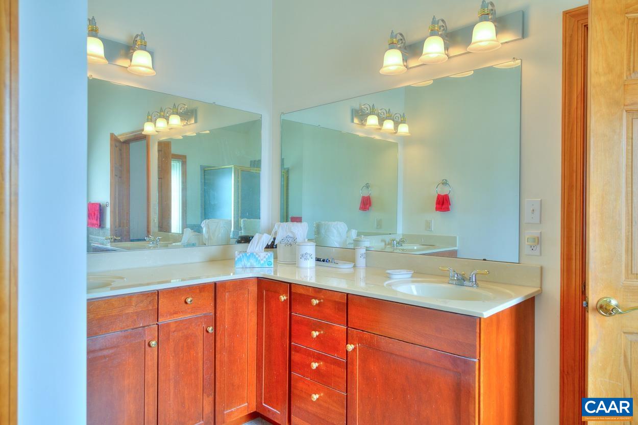 1908 Hollands Road Palmyra, VA 22963 - Photo 28 of 41 a bathroom with a sink vanity and a mirror