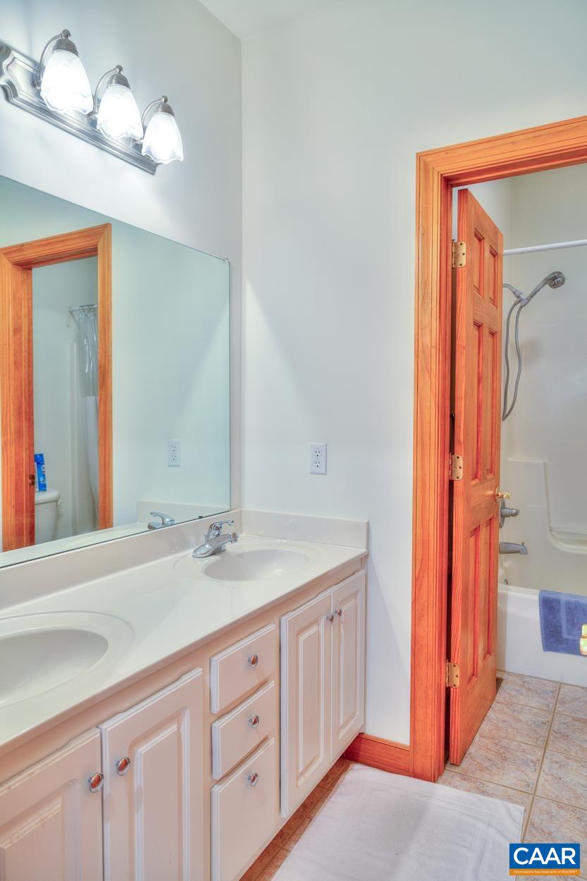 1908 Hollands Road Palmyra, VA 22963 - Photo 31 of 41 a bathroom with a sink vanity and a mirror