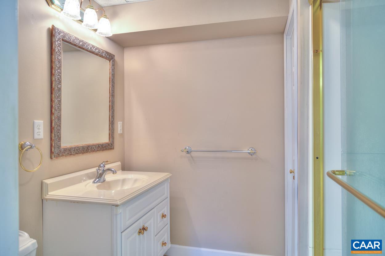 1908 Hollands Road Palmyra, VA 22963 - Photo 37 of 41 a bathroom with a sink and a mirror