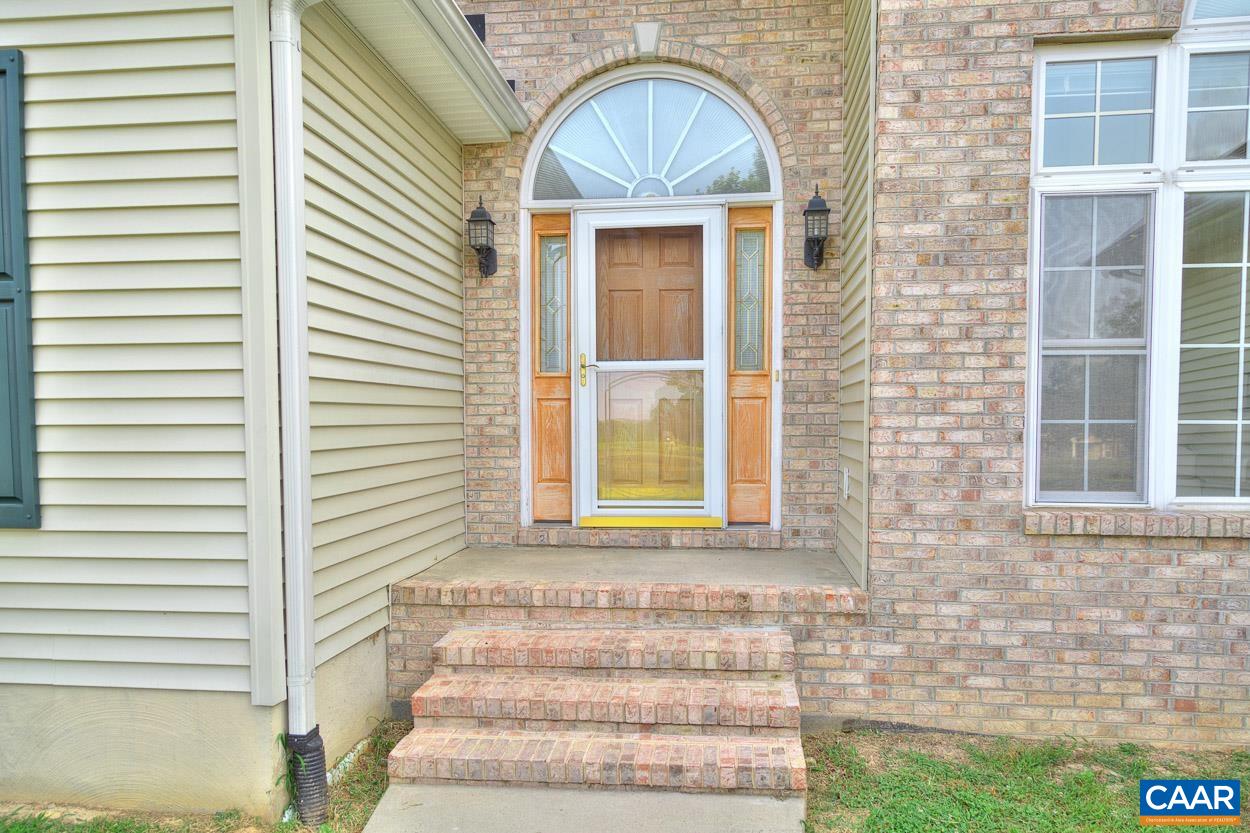 1908 Hollands Road Palmyra, VA 22963 - Photo 6 of 41 a front view of a house with a garden