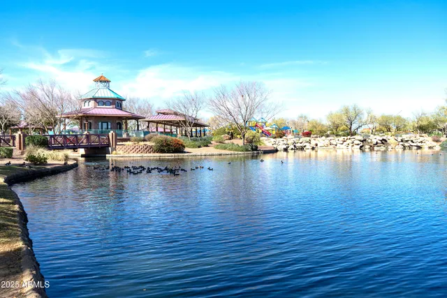 an aerial view of residential houses with outdoor space and seating