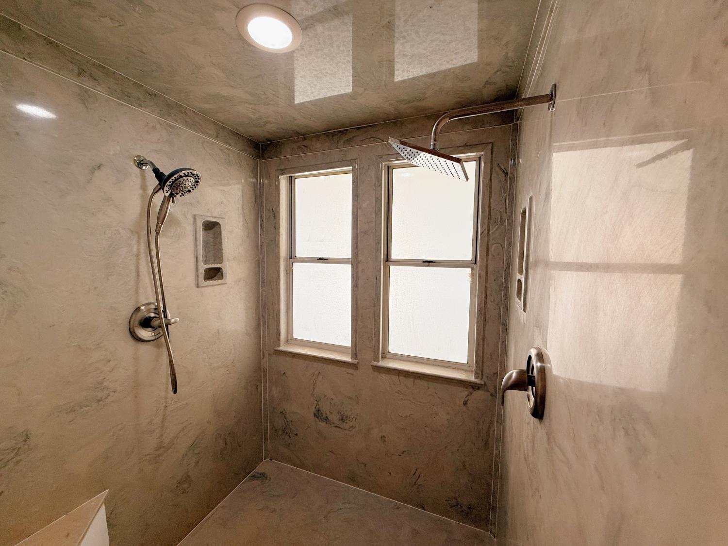 3147 Boulder Avenue Madera, CA 93637 - Photo 12 of 25 a bathroom with a shower