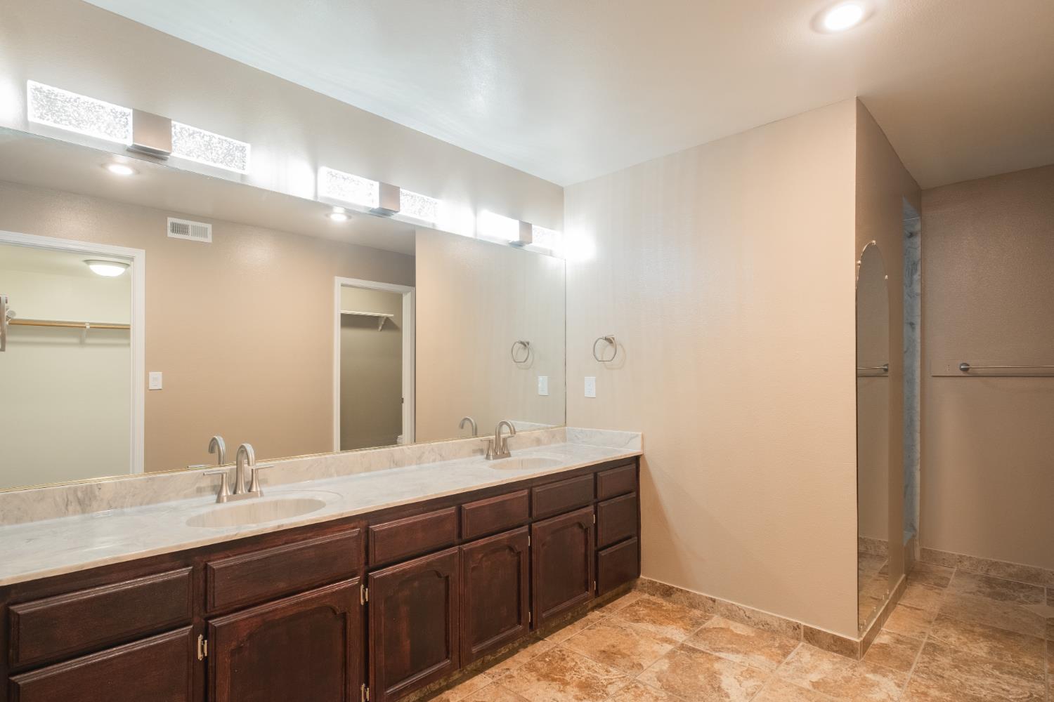3147 Boulder Avenue Madera, CA 93637 - Photo 14 of 29 a bathroom with a double vanity sink and a mirror