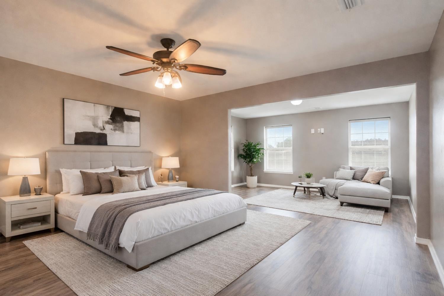 3147 Boulder Avenue Madera, CA 93637 - Photo 17 of 29 a bedroom with a large bed and a chandelier