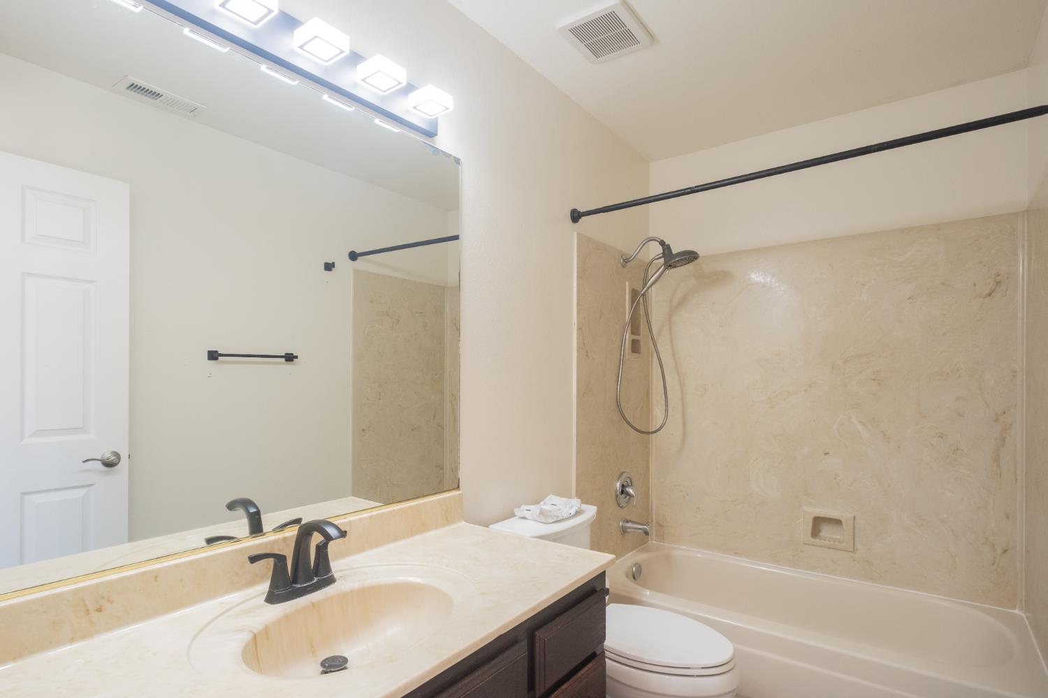 3147 Boulder Avenue Madera, CA 93637 - Photo 20 of 29 a bathroom with a sink and a mirror