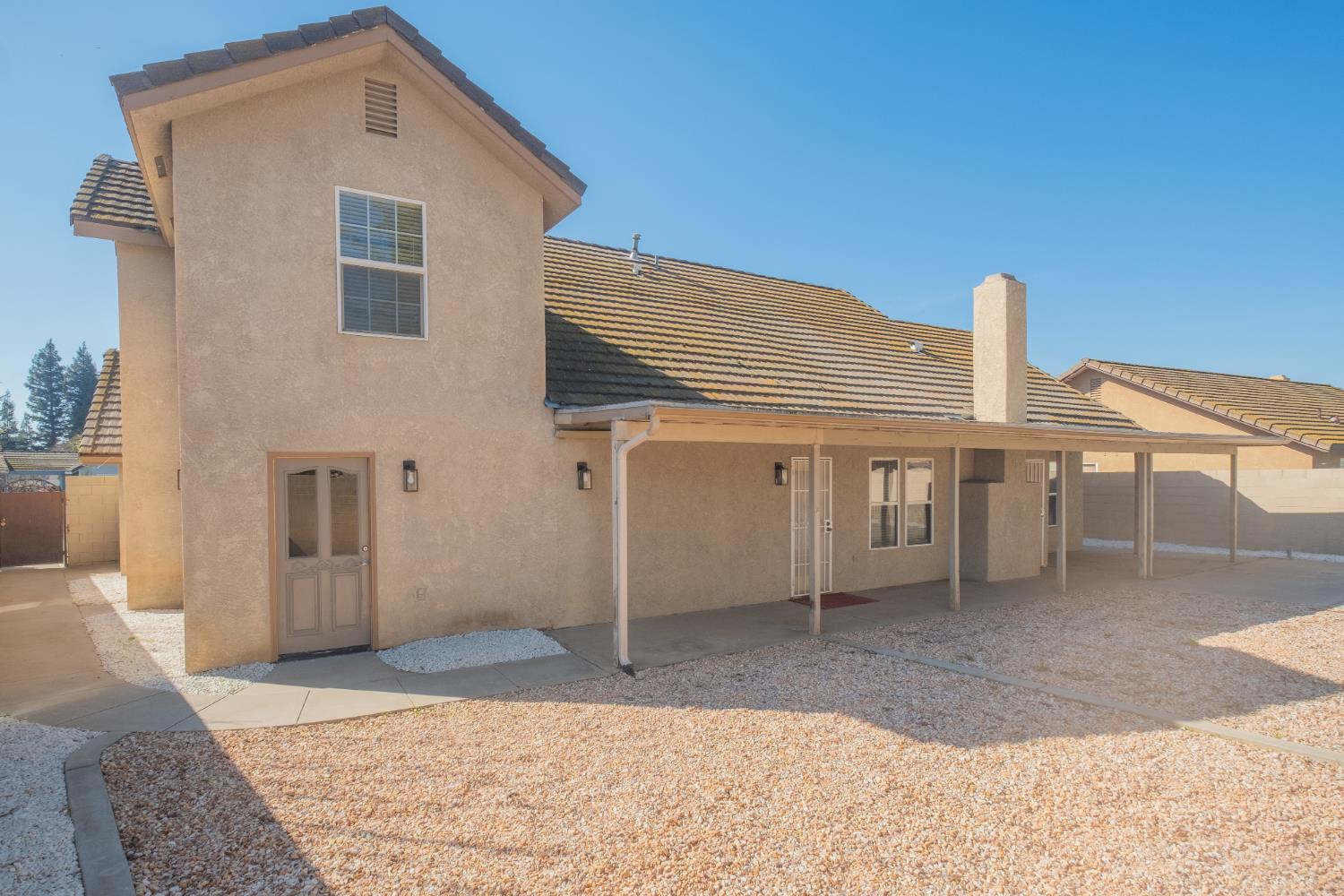 3147 Boulder Avenue Madera, CA 93637 - Photo 26 of 29 a view of a house with a backyard