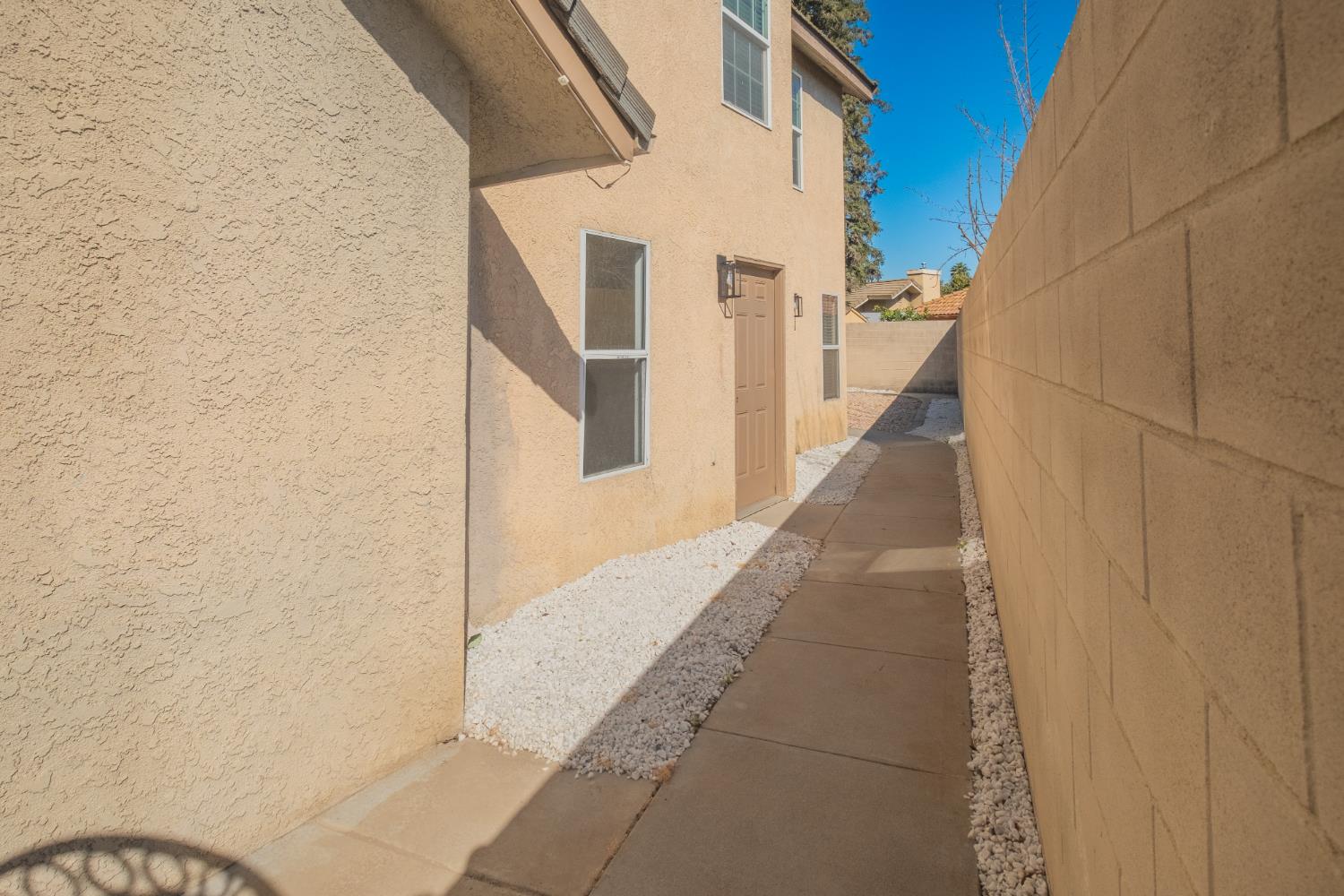 3147 Boulder Avenue Madera, CA 93637 - Photo 28 of 29 a view of a pathway both side of building