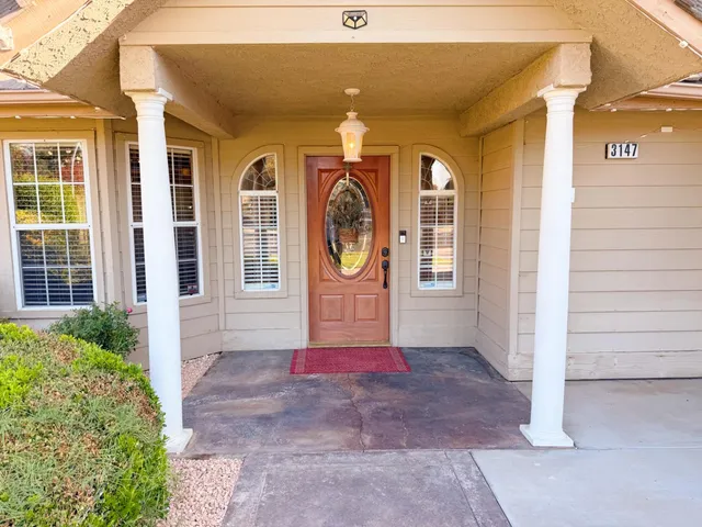 a front view of a house with large windows