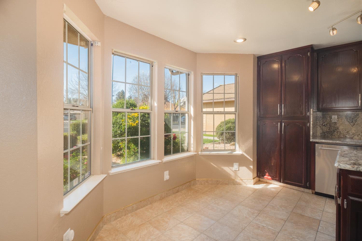3147 Boulder Avenue Madera, CA 93637 - Photo 8 of 29 a view of an empty room with a fireplace and a window