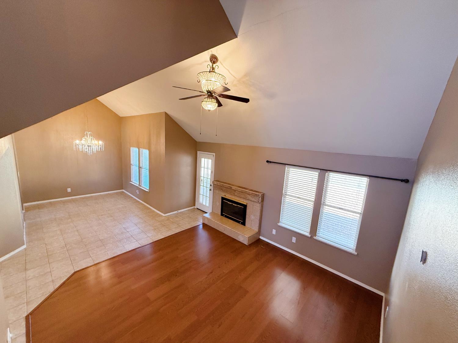3147 Boulder Avenue Madera, CA 93637 - Photo 9 of 25 wooden floor in an empty room with a window