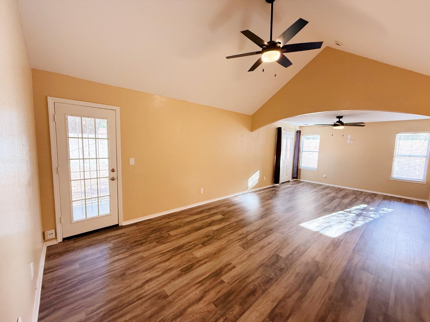 3147 Boulder Avenue Madera, CA 93637 - Photo 10 of 25 wooden floor in an empty room with a window