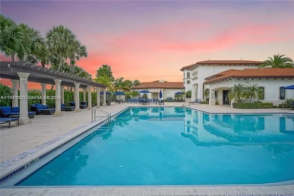 a view of swimming pool with outdoor seating