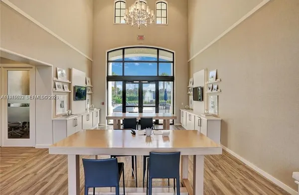 an aerial view of a house with a garden and lake view