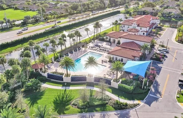 an aerial view of a houses with a city street