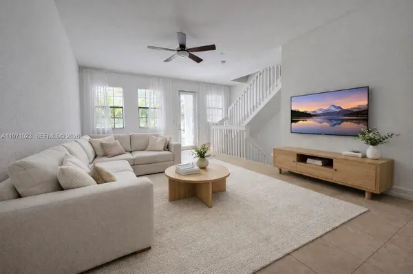 a living room with furniture and a flat screen tv