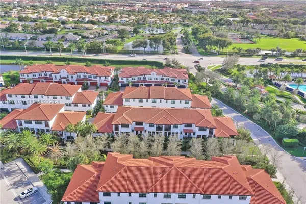 a view of a garden with a fountain and a plants