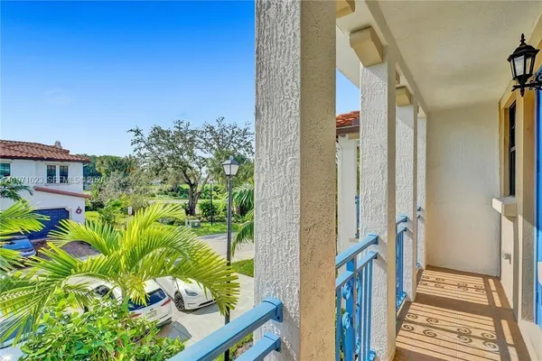 a view of a balcony with plants