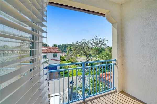 a view of balcony with furniture