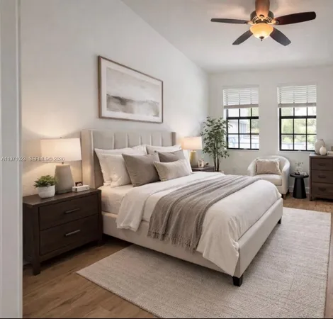 a bedroom with a bed and window