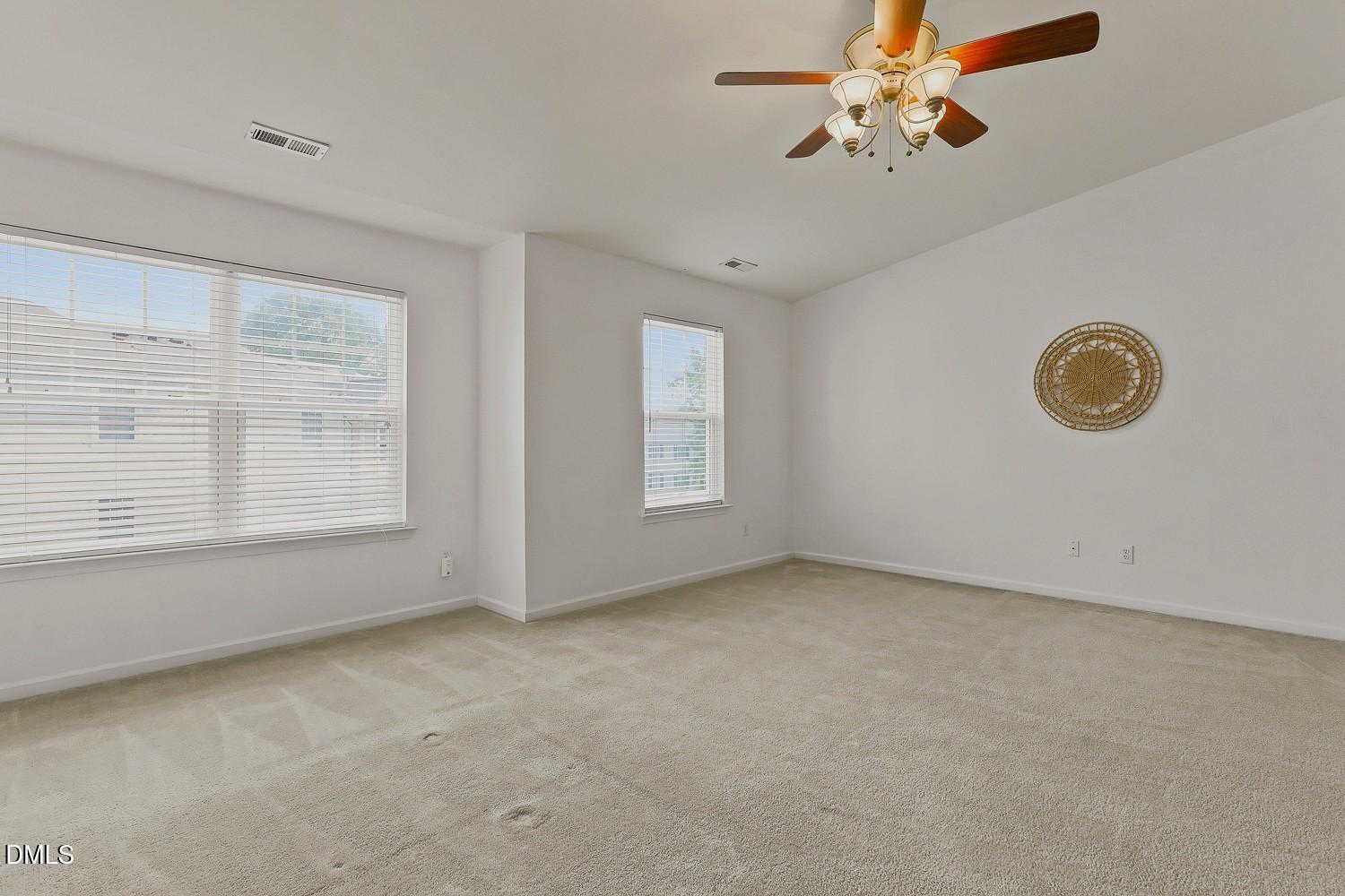 8620 Neuse Club Lane, Unit 107 Raleigh, NC 27616 - Photo 22 of 33 022-031-Primary Bedroom-1500x1000