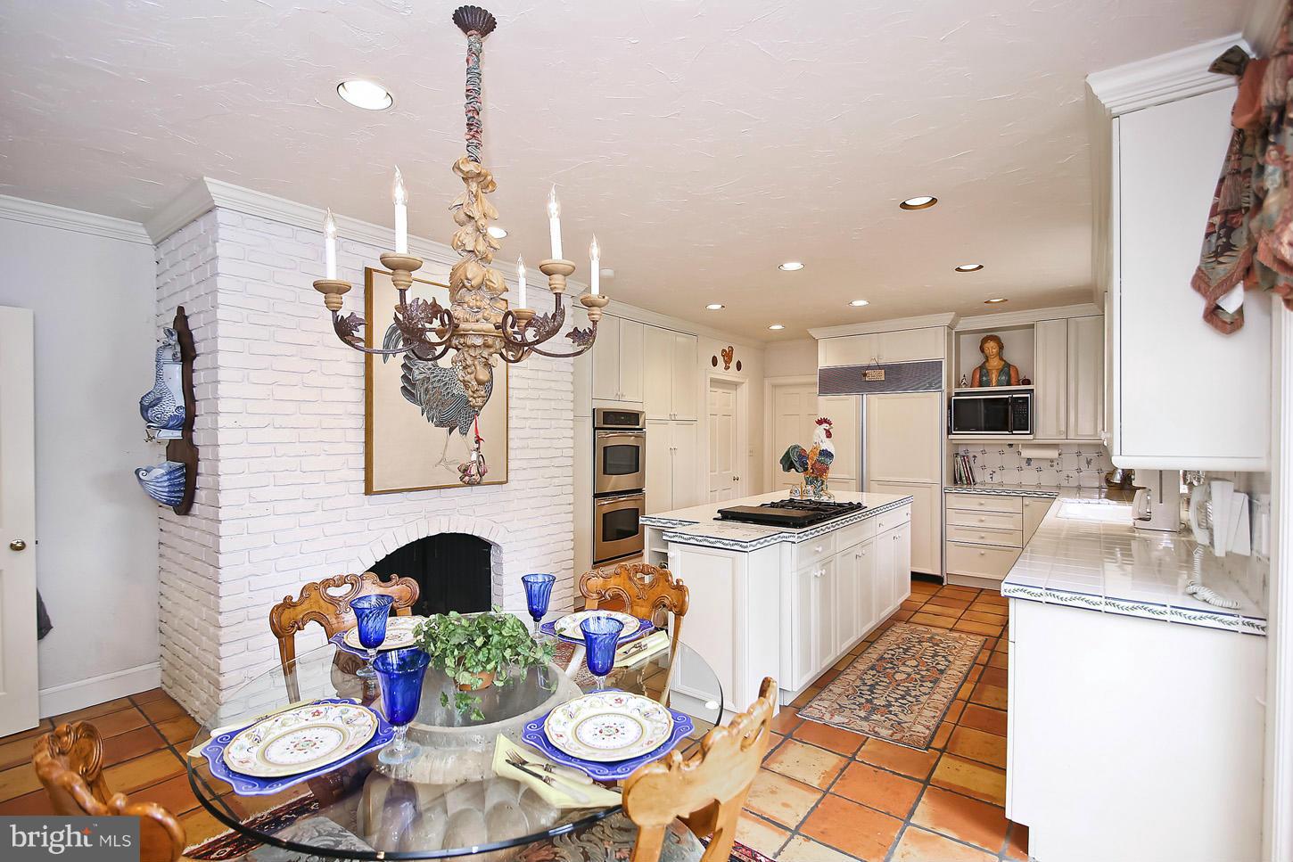 10112 Norton Road Potomac, MD 20854 - Photo 14 of 30 a kitchen with furniture and a fireplace