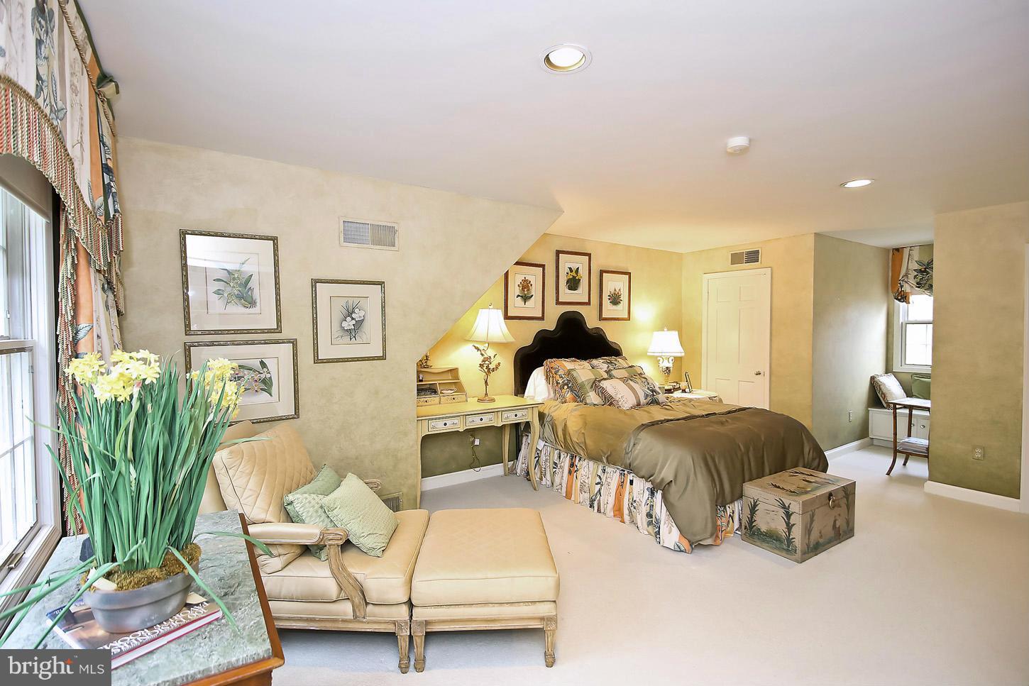 10112 Norton Road Potomac, MD 20854 - Photo 22 of 30 a bedroom with furniture and a large window